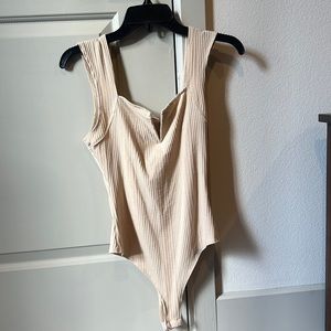 Gently worn v neck ribbed bodysuit